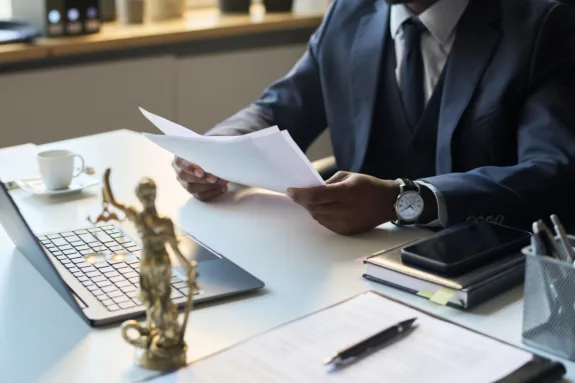 Black male legal attorney working in office